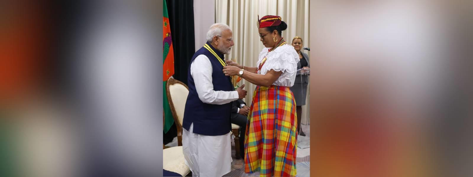 H.E. Ms. Sylvanie Burton, President of the Commonwealth of Dominica conferred the highest National Award-"Dominica Award of Honour" on Prime Minister Shri Narendra Modi